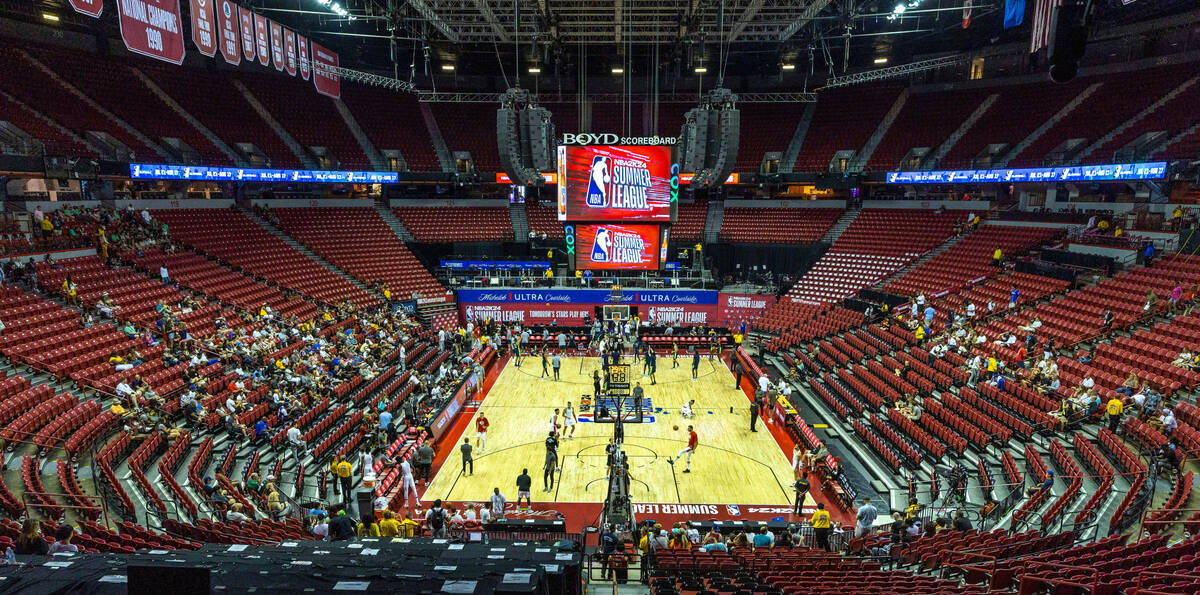 Players warm up on the court before the first half of their NBA Summer League game at the Thoma ...