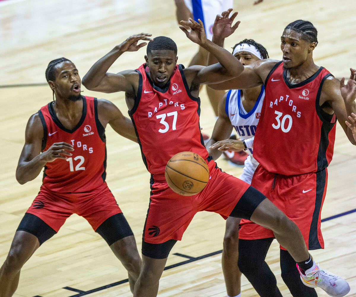 Toronto Raptors guard Darryl Morsell (37) looks to a loose ball with teammates guard RJ Nembhar ...