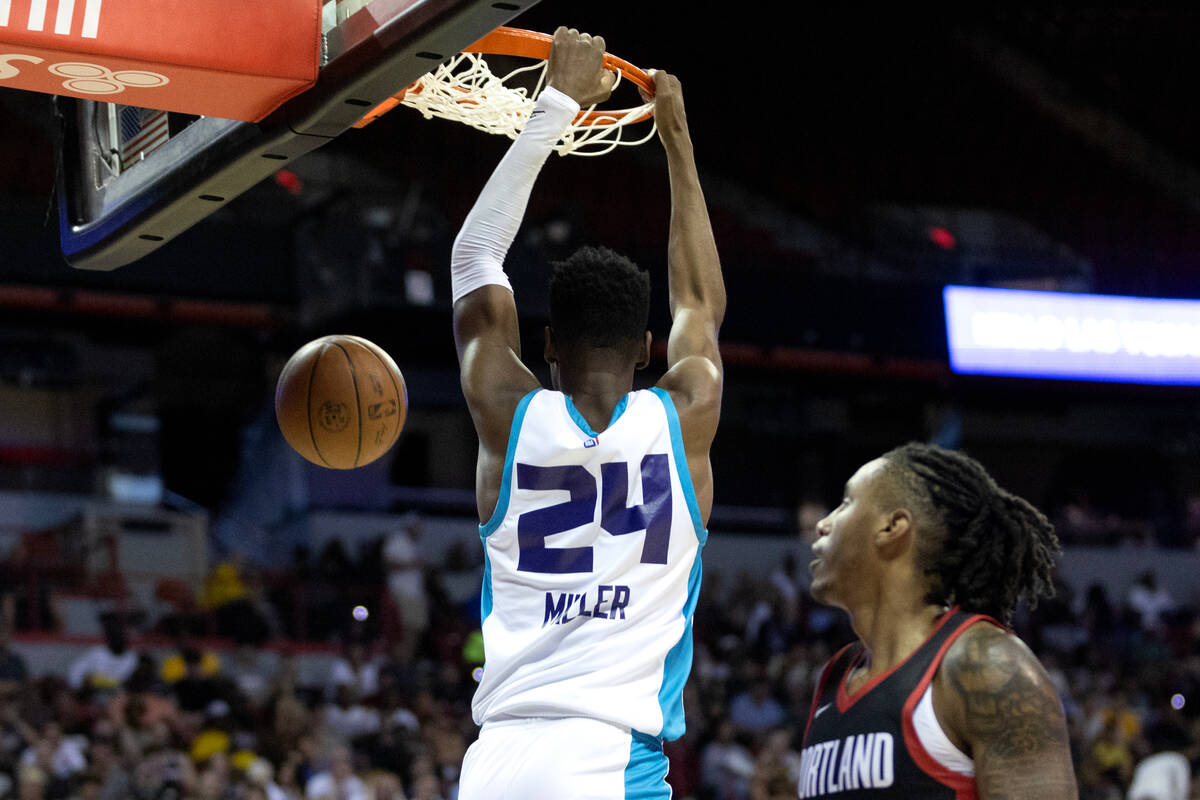 Charlotte Hornets forward Brandon Miller (24) dunks on the Portland Trailblazers during a NBA S ...