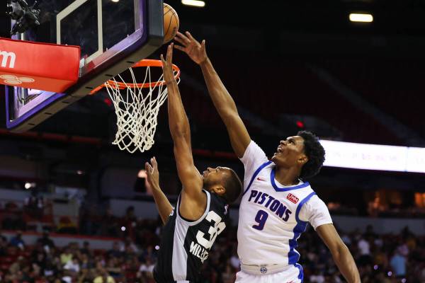 San Antonio Spurs guard/forward Seth Millner (36) goes in for a layup as Detroit Pistons guard ...