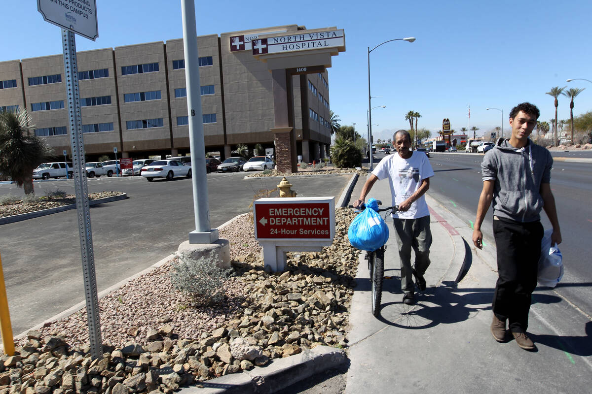 Carlos Sanchez, 61, left, and his son, Jacob Edward Delgado, 23, walk to a bus stop after  ...