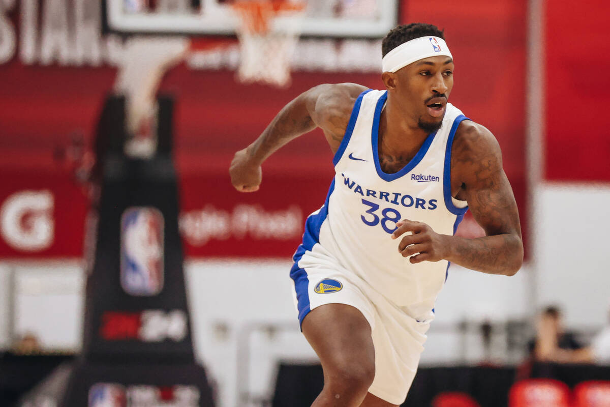 Golden State Warriors guard Craig Sword runs down the court during an NBA Summer League game ag ...