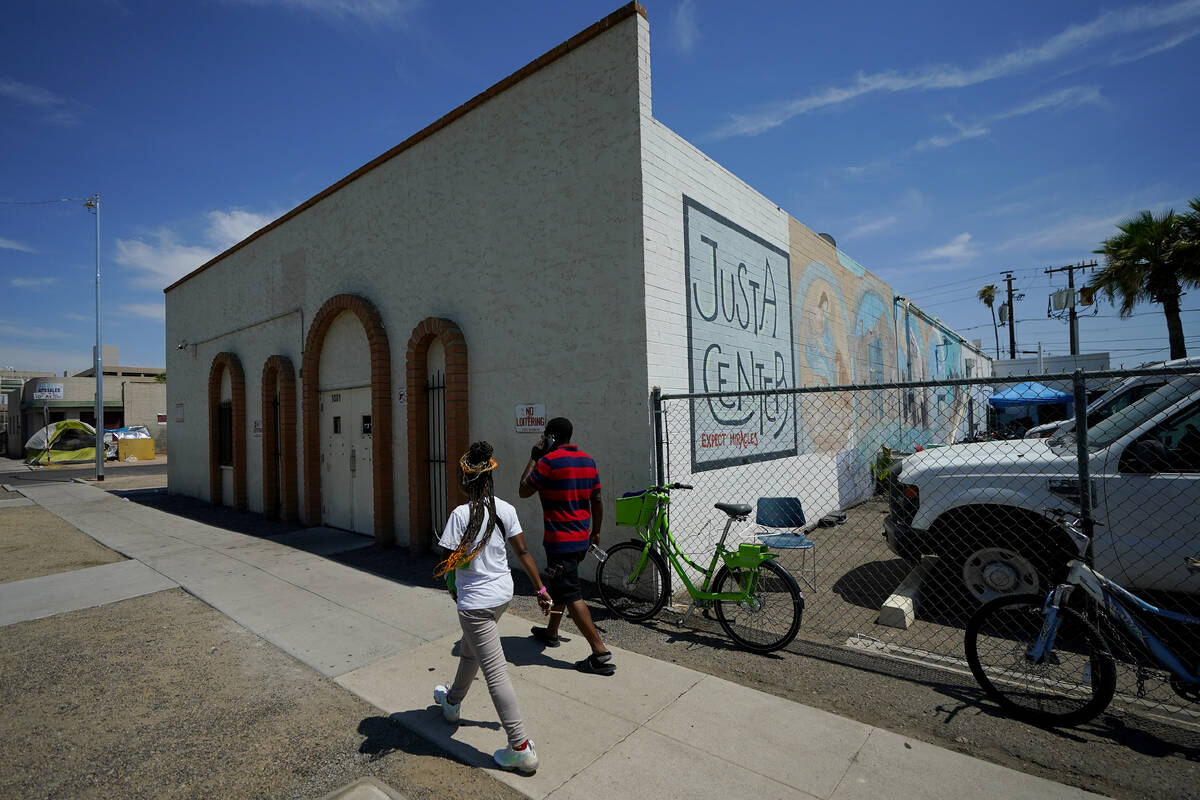 Volunteers walks outside the Justa Center, a day center for homeless people 55 years and older, ...