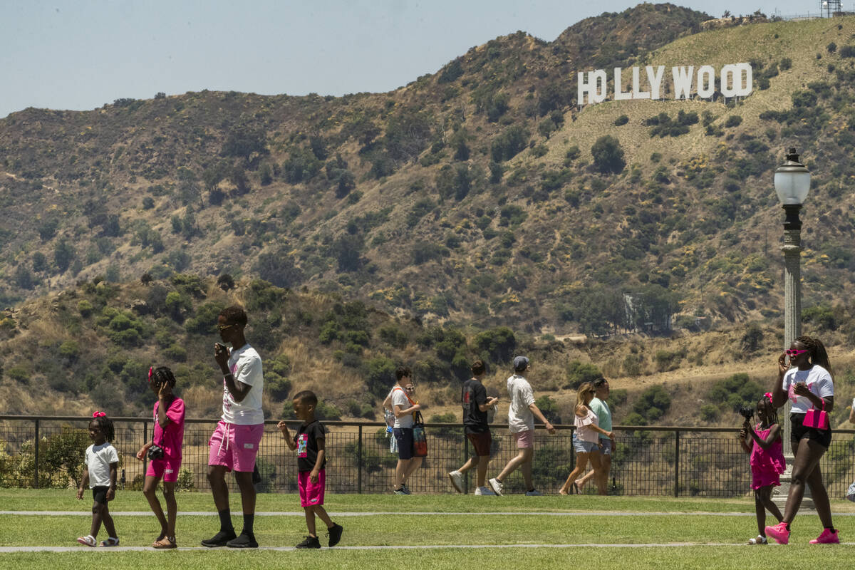 Visitors tour the Griffith Observatory gardens in Los Angeles Friday, July 14, 2023. Over a thi ...