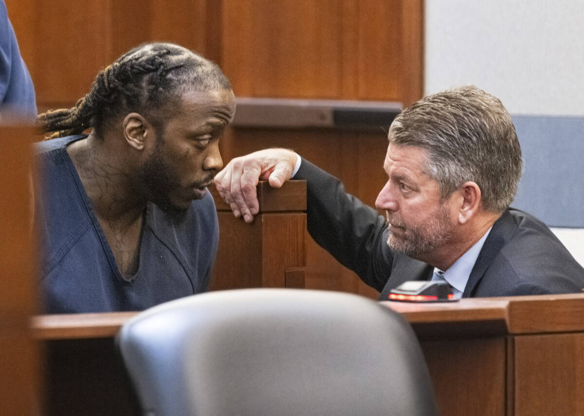 Durwin Allen, left, listens to his attorney Peter Christiansen after his sentencing at the Regi ...