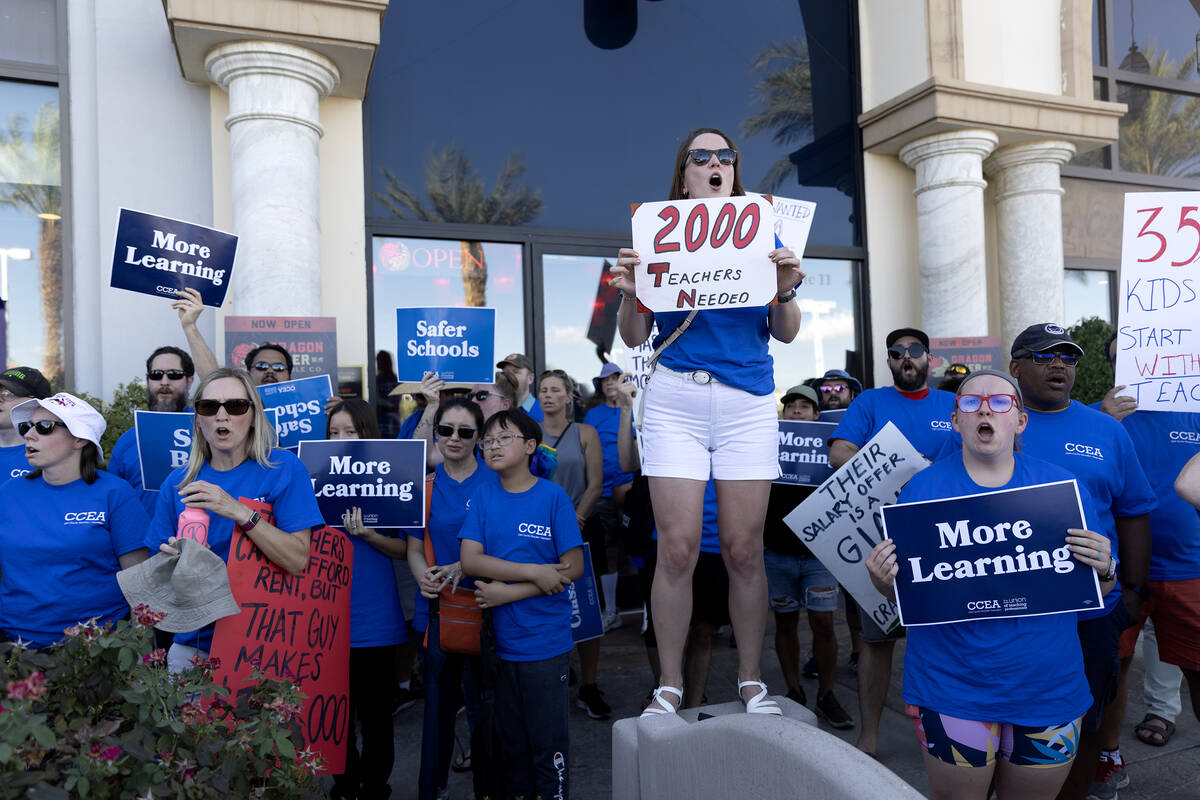 Educators with the Clark County Education Association, including school psychologist Jordan Wen ...