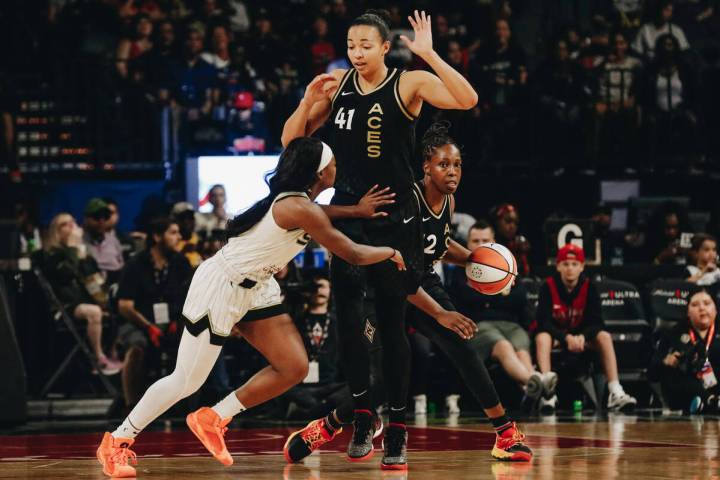 Las Vegas Aces center Kiah Stokes (41) puts her hands up as Chicago Sky guard Dana Evans (11) t ...