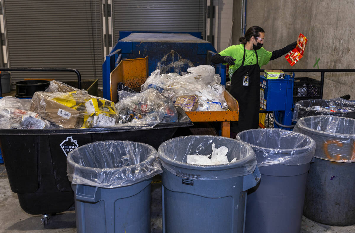 Trash is sorted for recyclables at Allegiant Stadium which contributes to the stadium now LEED ...