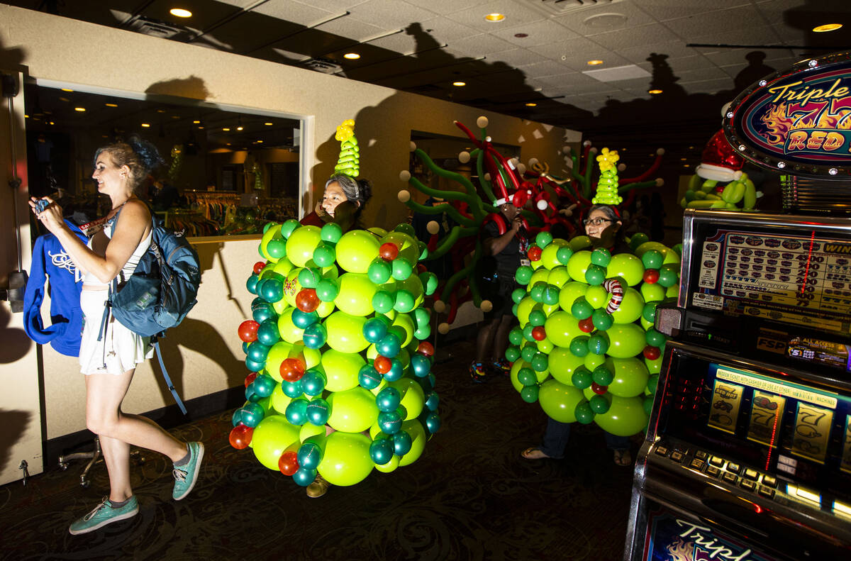 Attendees of the Bling Bling Jam balloon convention, including Cecilia Villar, second from left ...