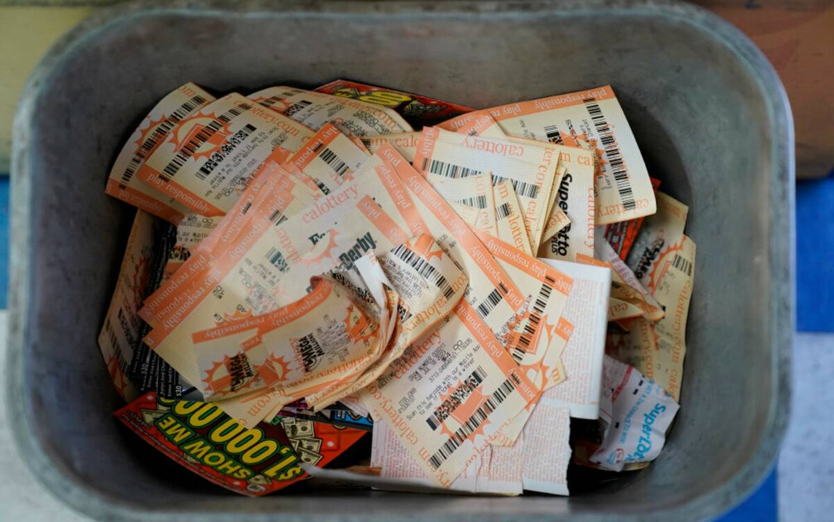 Powerball ticket receipts are seen in the garbage, Wednesday, July 19, 2023, in Hawthorne, Cali ...