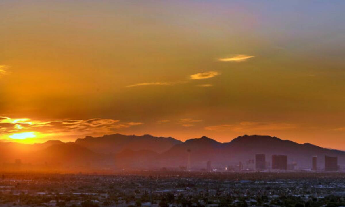 The sun rises over the valley and Strip on Thursday, July 20, 2023, in Las Vegas (L.E. Baskow/L ...