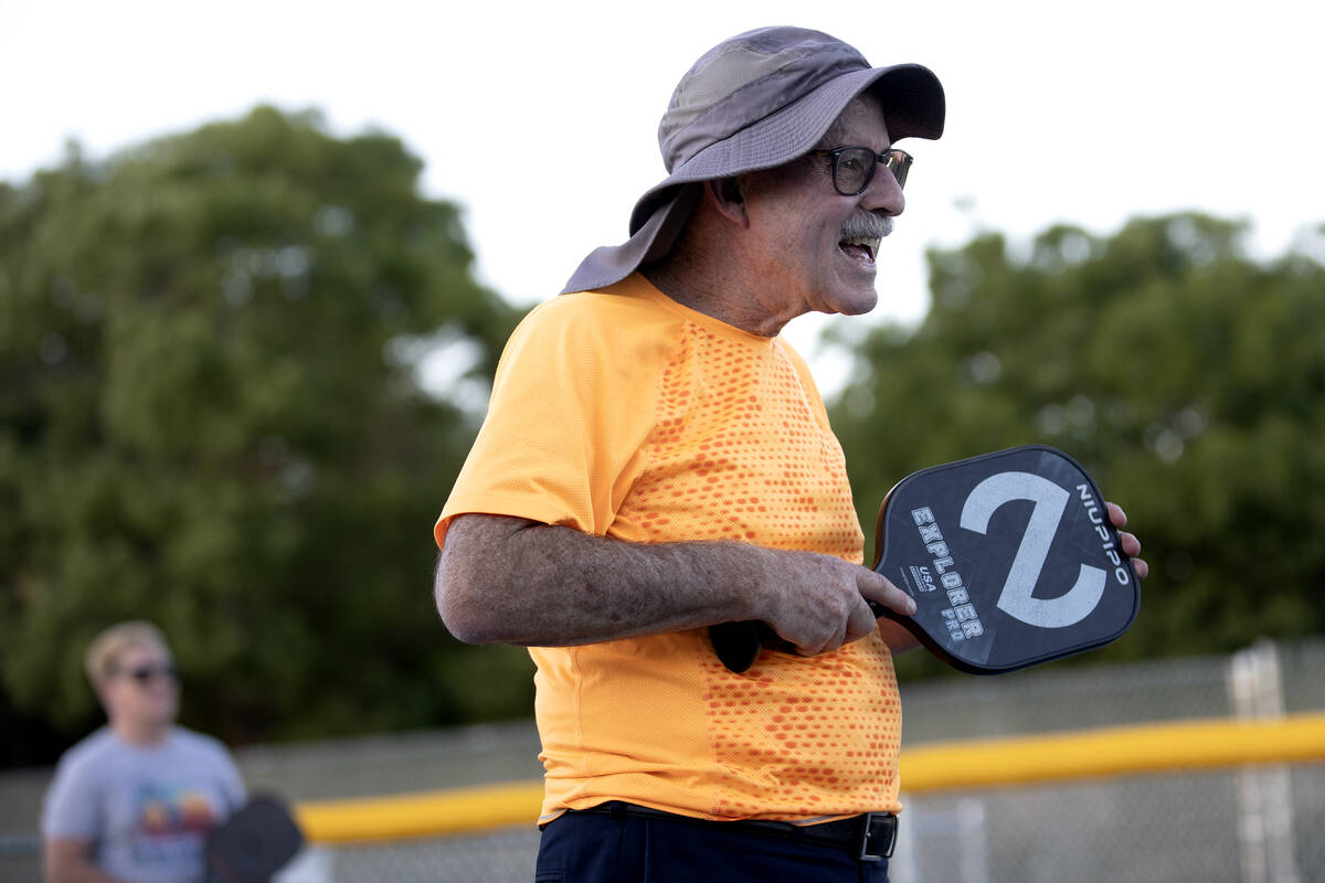 Dave Wise, a member of the Neon Picklers, smiles during a pickleball game at Aloha Shores Park ...