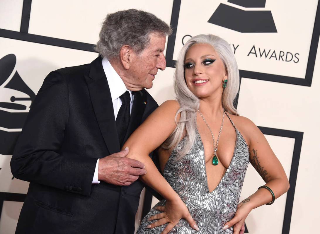 FILE - Tony Bennett, left, and Lady Gaga appear at the 57th annual Grammy Awards in Los Angeles ...