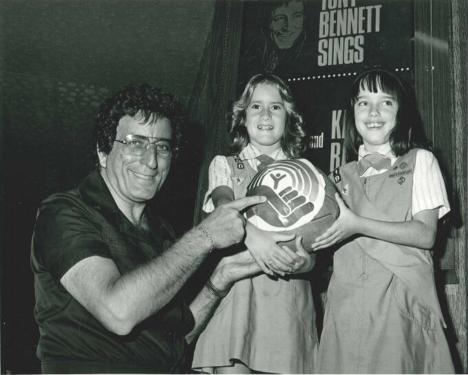 Girl scouts pose with singer Tony Bennett and the United Way of Southern Nevada in an undated p ...