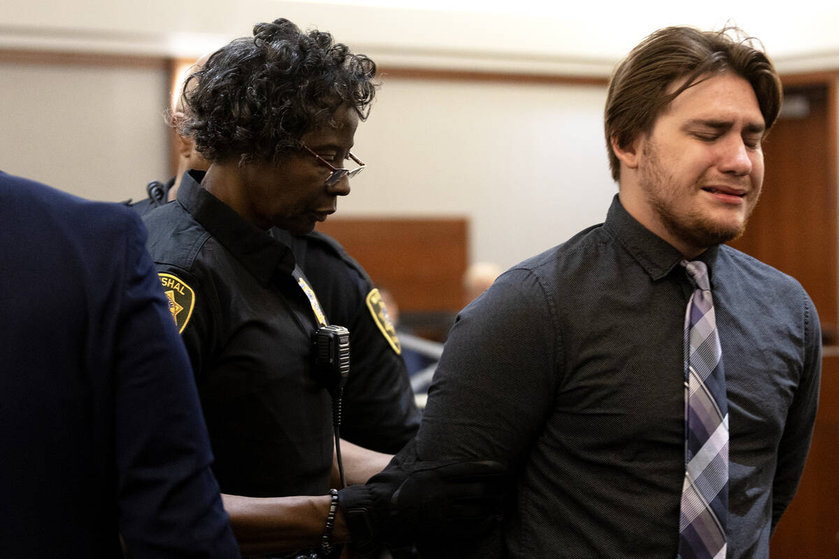 Angelo Loza, right, cries while being taken into custody after he was sentenced to 2 to 8 years ...