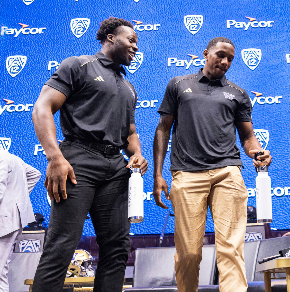 Washington Huskies linebacker Edefuan Ulofoshio, left, and quarterback Michael Penix Jr., leave ...