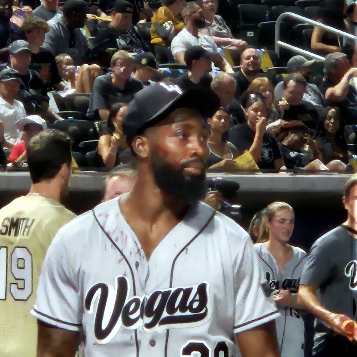 Blood from a forehead cut can be seen on Nate Hobbs jersey after a flyball hit him in the face ...