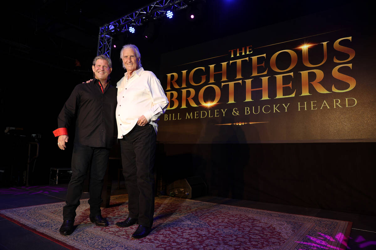 Bucky Heard, left, and Bill Medley of the Righteous Brothers pose for a photo after participati ...