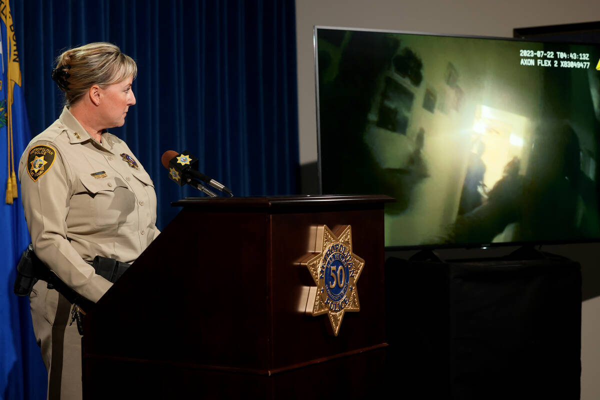 Assistant Sheriff Jamie Prosser shows body worn camera footage of suspect Dusty Porter during a ...