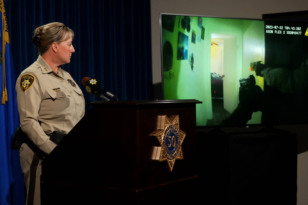 Assistant Sheriff Jamie Prosser shows body worn camera footage of the apprehension of suspect D ...