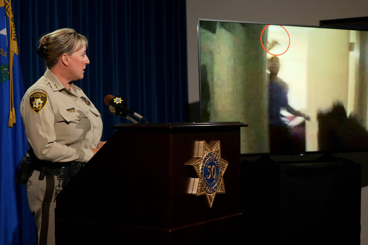 Assistant Sheriff Jamie Prosser shows body worn camera footage of suspect Dusty Porter during a ...