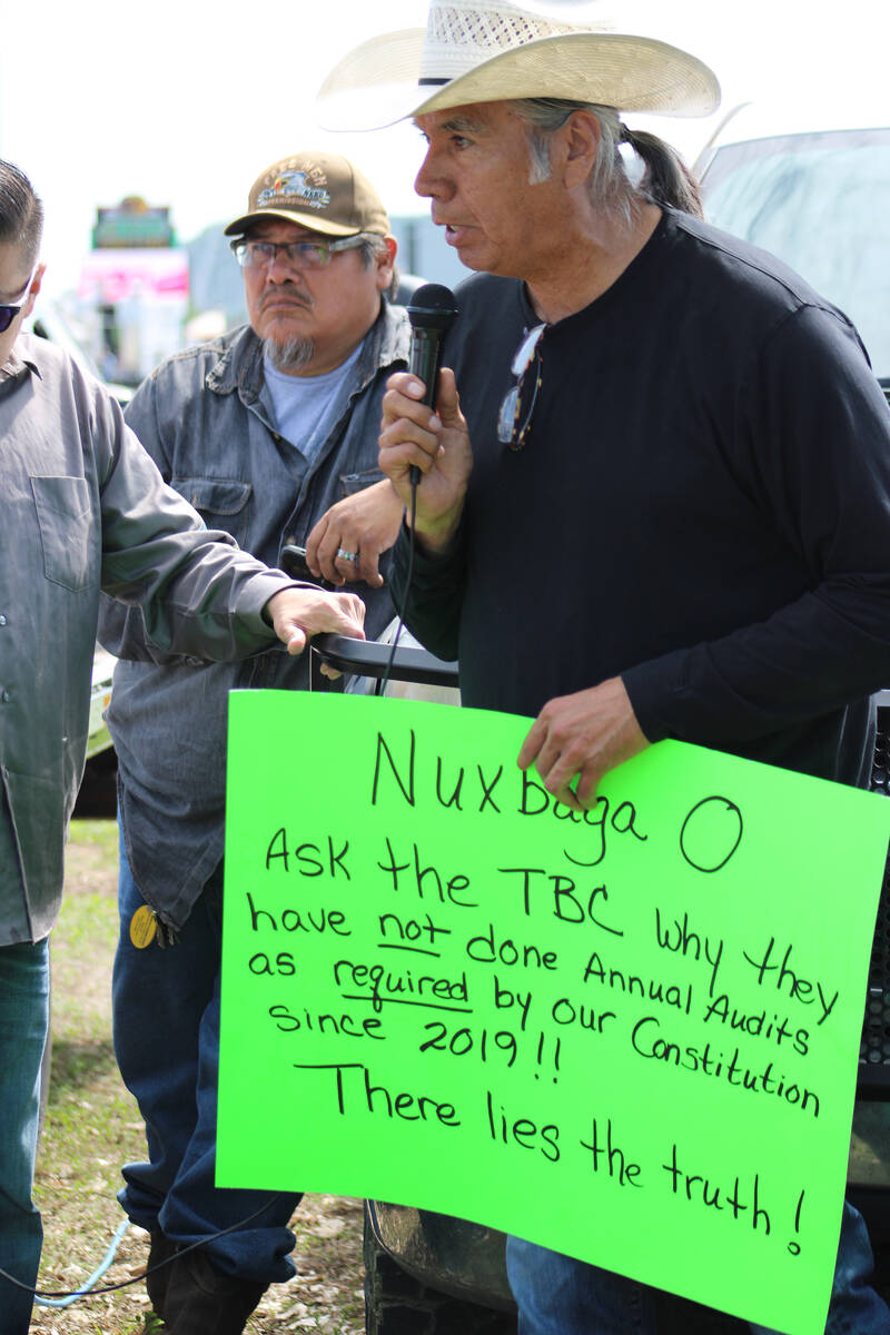 Former MHA Nation chairman Tex Hall, right, holds a sign at a protest in North Dakota on Saturd ...
