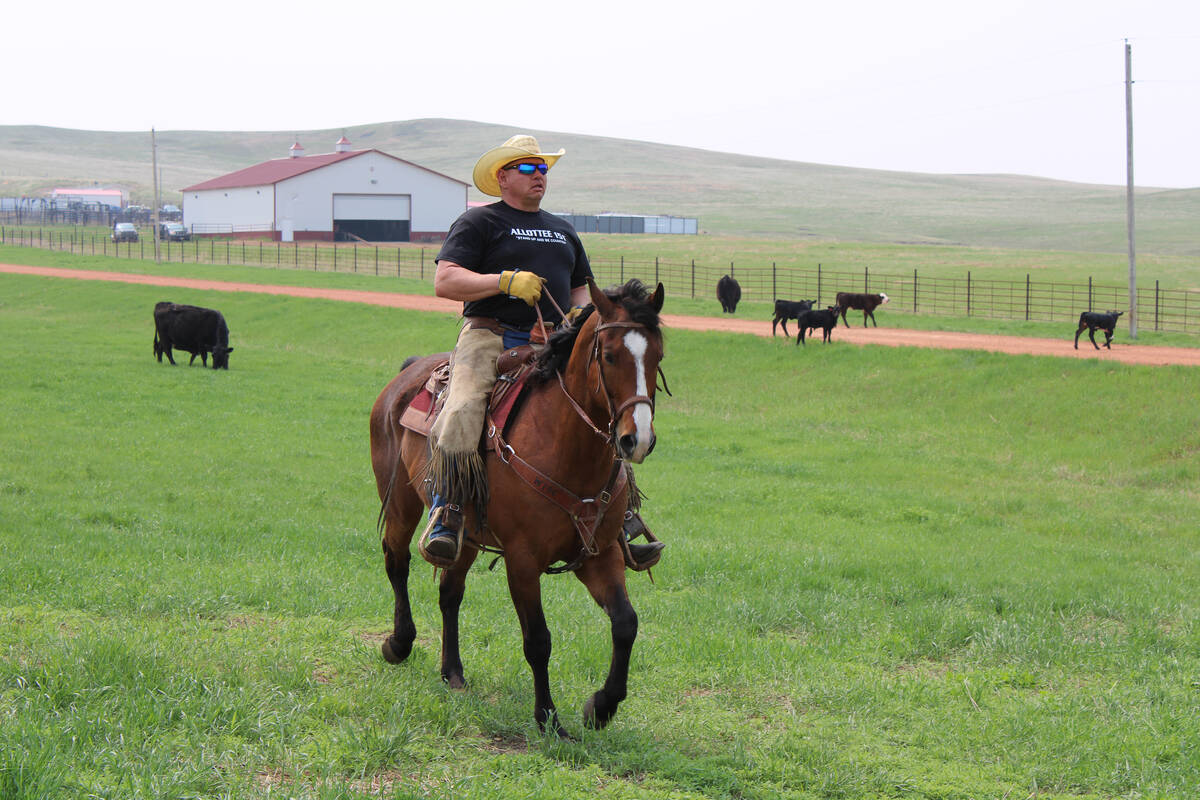 Cattle rancher Todd Hall rides horseback on his ranch near Dunn Center, North Dakota, on Sunday ...