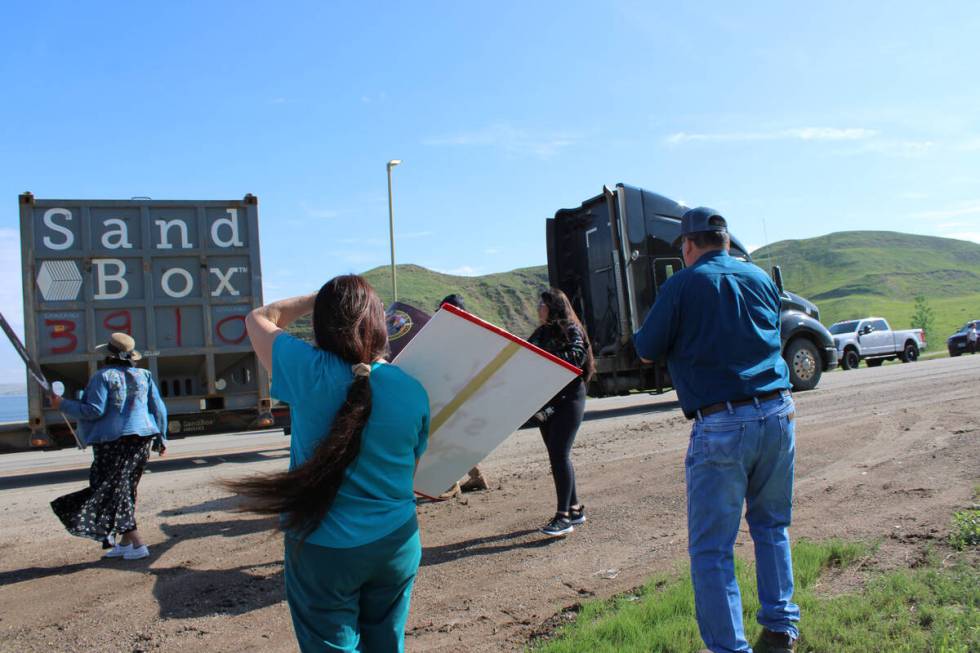 People on the side of Highway 22 protest against MHA Nation leadership in New Town, North Dakota.