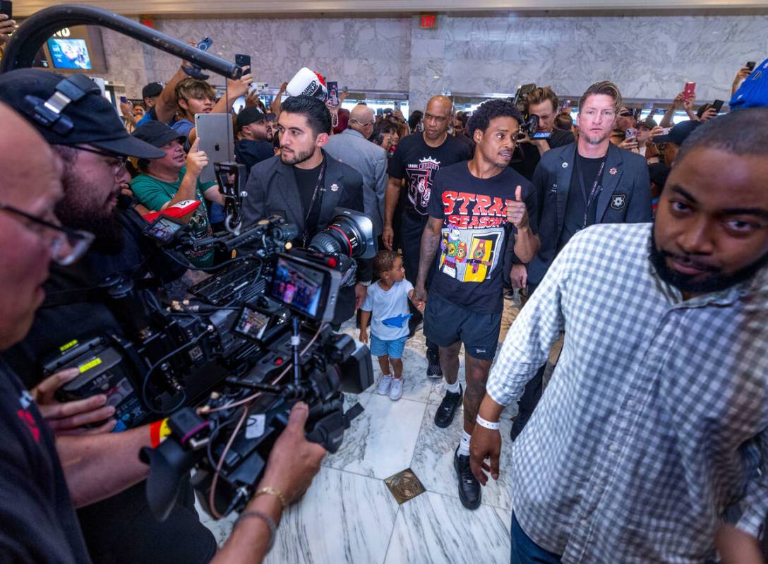 Welterweight boxer Errol Spence Jr., walks in with his son Dallas during grand arrivals inside ...