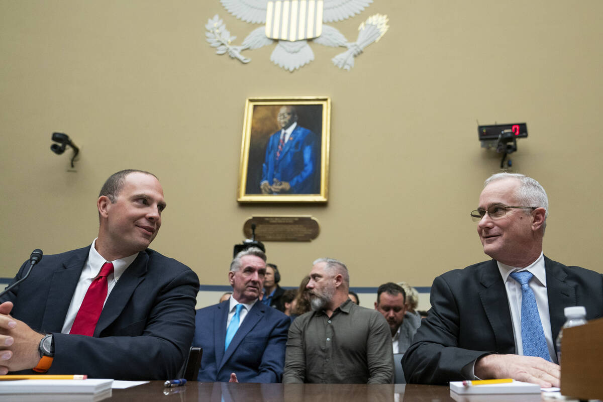 U.S. Air Force (Ret.) Maj. David Grusch, left, and U.S. Navy (Ret.) Cmdr. David Fravor speak pr ...