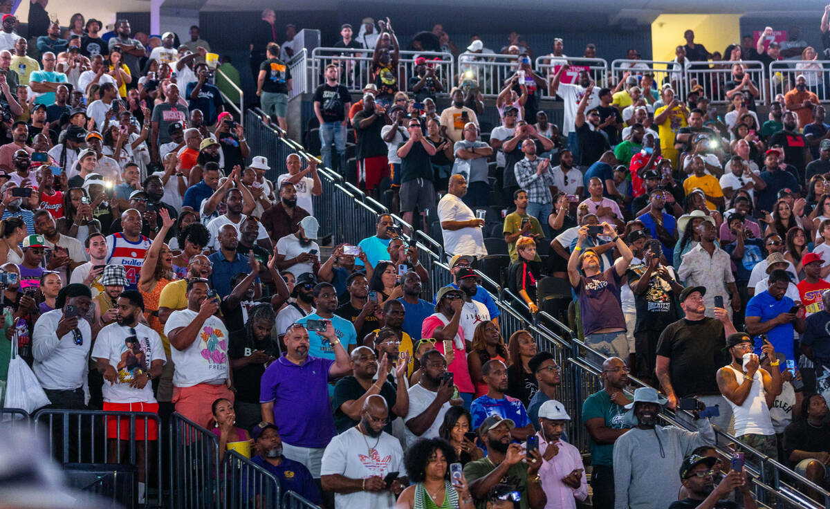 Fans cheer for boxers Errol Spence Jr. and Terence Crawford as they come together following the ...