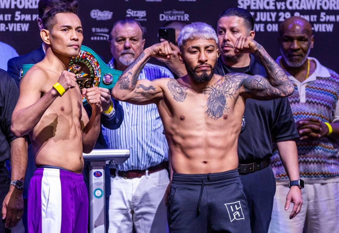 Boxers Nonito Donaire and Alexandro Santiago pose following their weigh-ins ahead of their figh ...