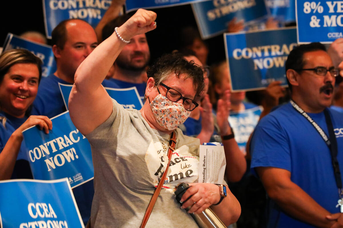 Lucie Sample cheers alongside other teachers and faculty of Clark County School District at a C ...