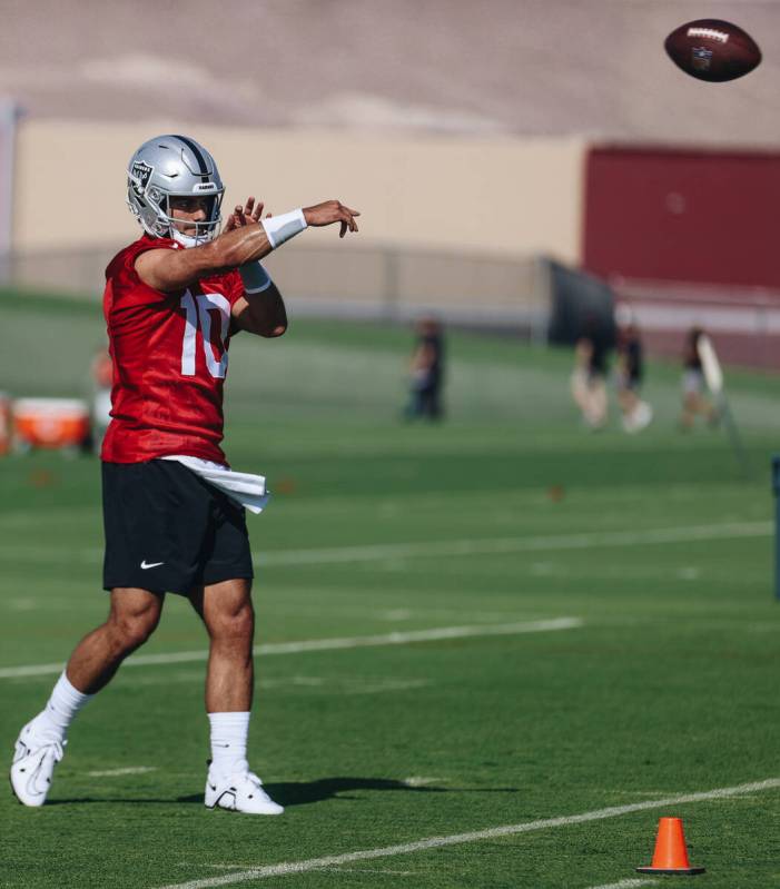 Raiders quarterback Jimmy Garoppolo throws the ball during training camp at the Intermountain H ...