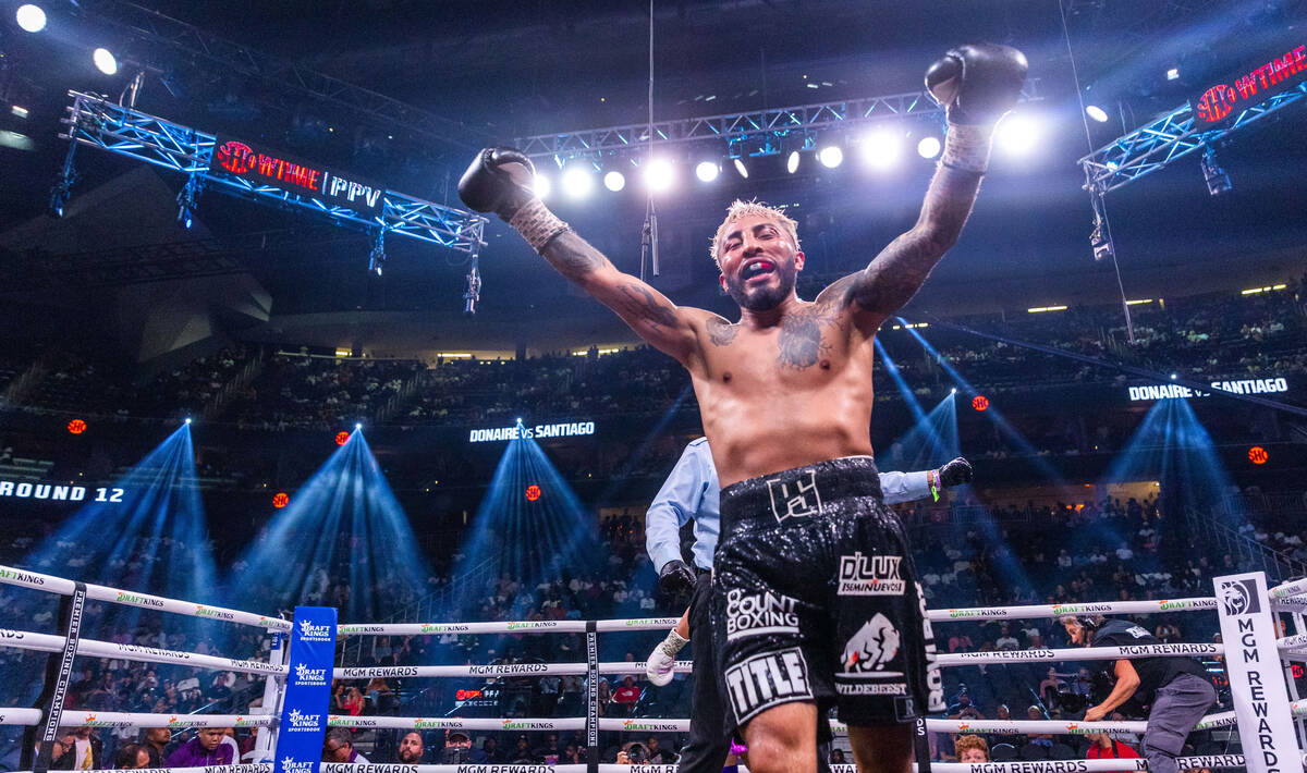 Alexandro Santiago celebrates his win over Nonito Donaire after 12 rounds during a WBC world ba ...