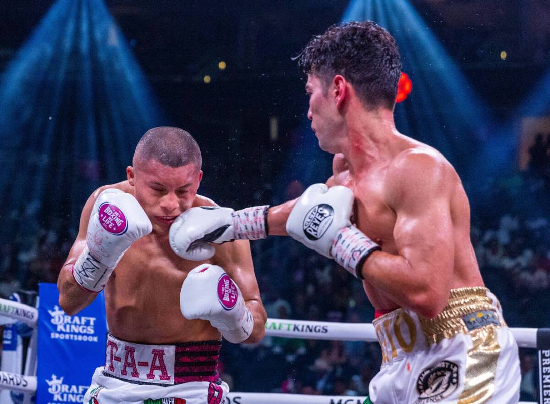 Isaac Cruz is hit in the chin by Giovanni Cabrera in round 6 during world welterweight, WBC Sil ...