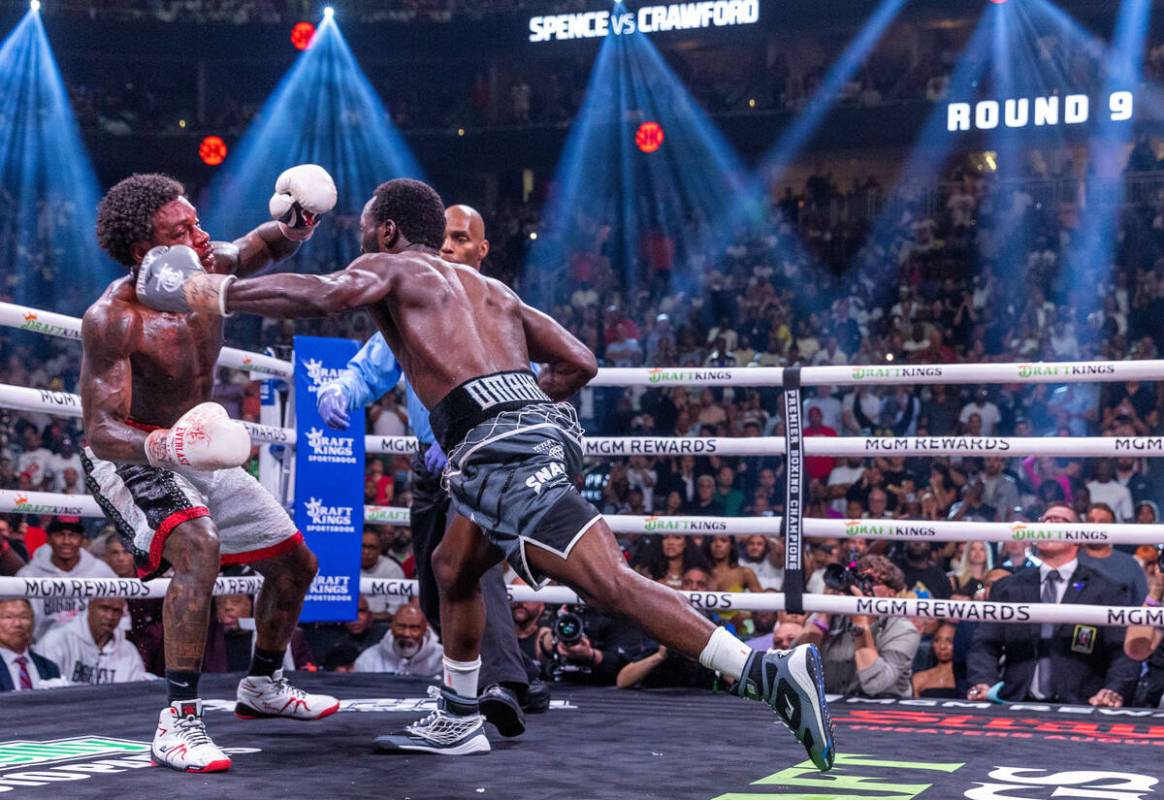 Terence Crawford strikes Errol Spence Jr., for the final time before the fight is ended in roun ...