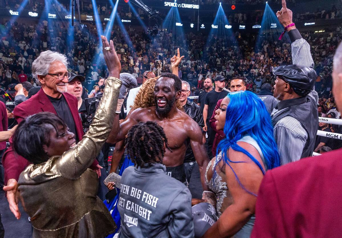 Terence Crawford celebrates his win with his family over Errol Spence Jr., ended in round 9 dur ...