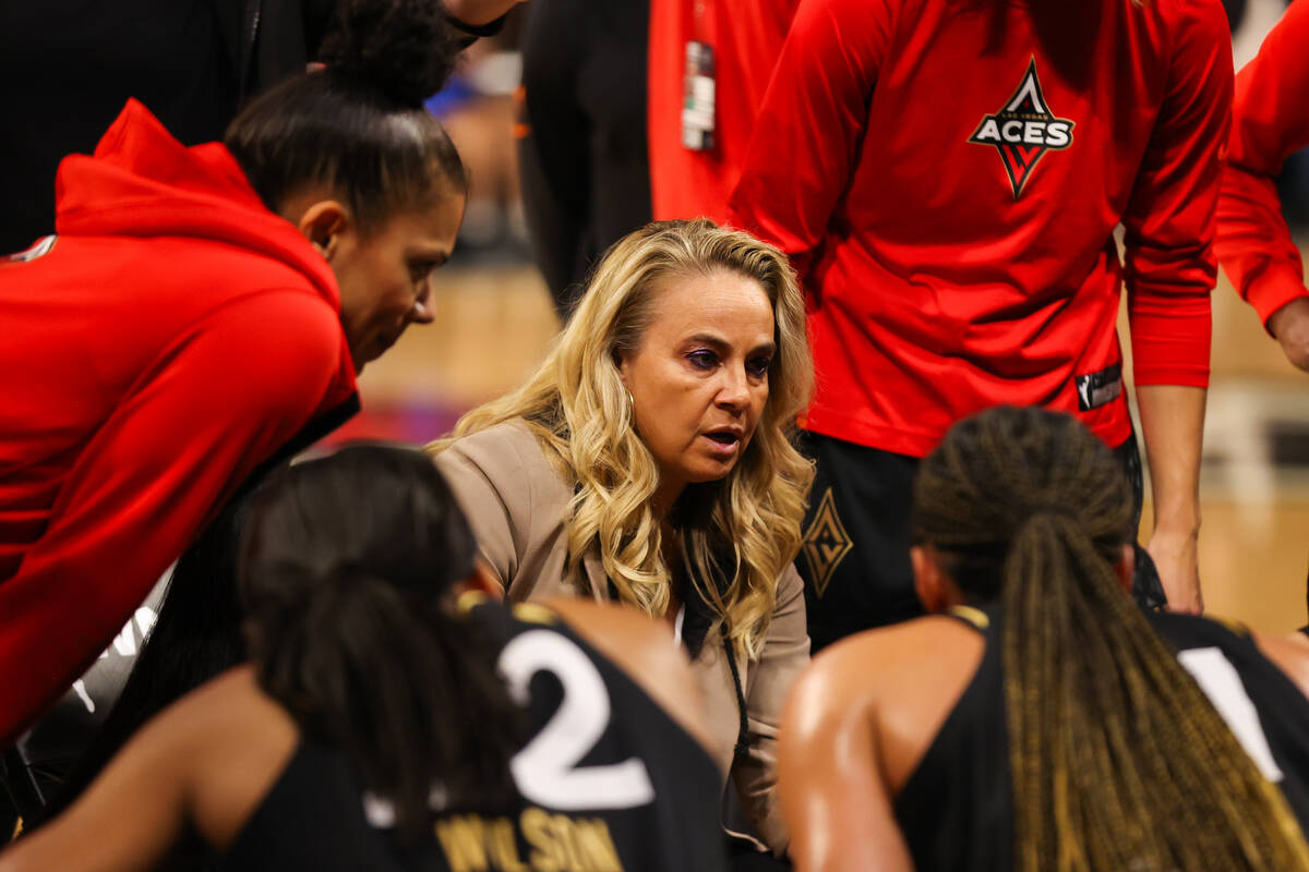 Las Vegas Aces head coach Becky Hammon talks to her players during a timeout at a WNBA basketba ...