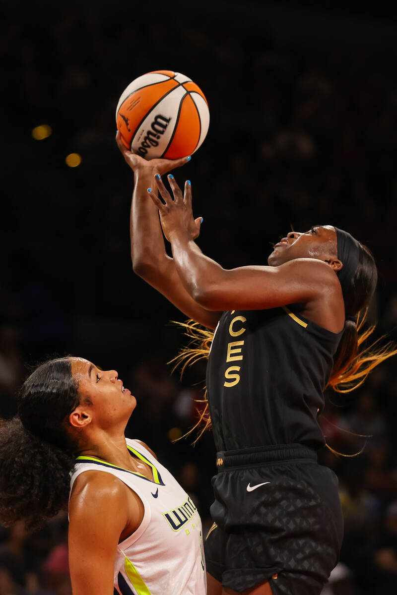 Las Vegas Aces guard Jackie Young (0) goes in for a layup during a WNBA basketball game against ...
