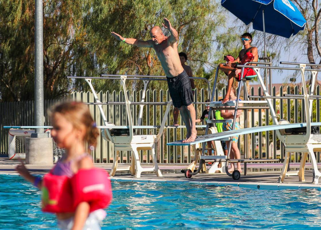 Patrick McDonald prepares to dive into the pool at the Splash Back to School Party and School S ...