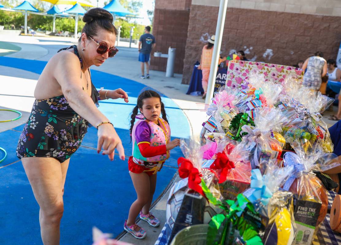 Jodi Achberger shows Emelina Achberger all of the different back to school supplies that she ca ...