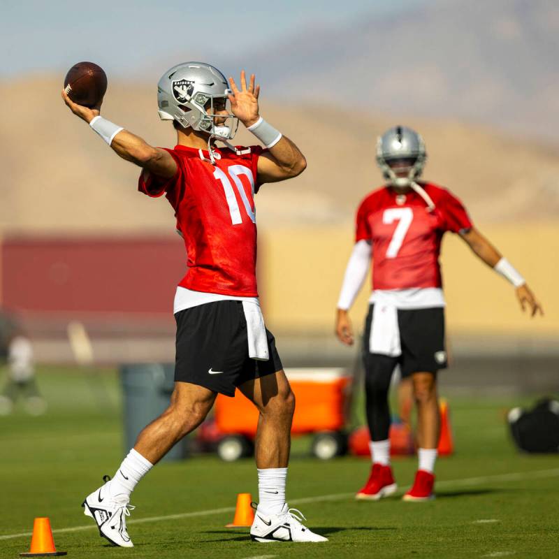 Raiders quarterback Jimmy Garoppolo throws the ball during a youth football camp as part of Fan ...