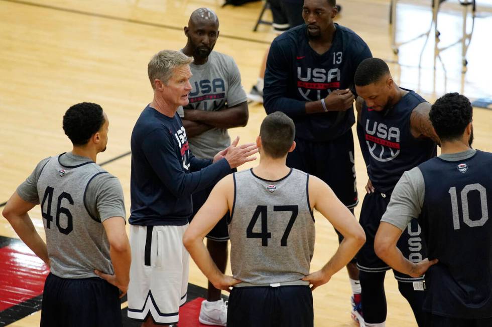 FILE - Assistant coach Steve Kerr, second from left, speaks with players during training for US ...