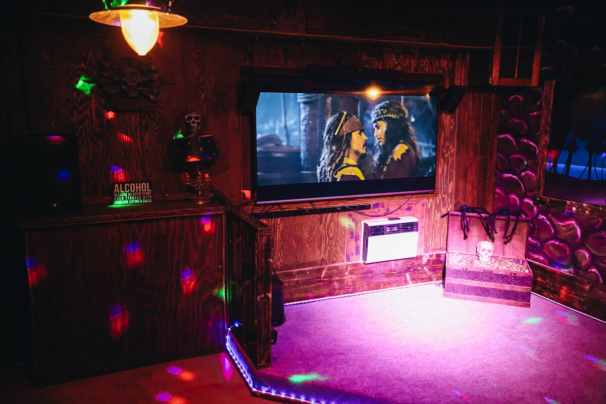 A bar room equipped with a disco ball and DJ sayer is seen in a pirate-themed house on Wednesda ...