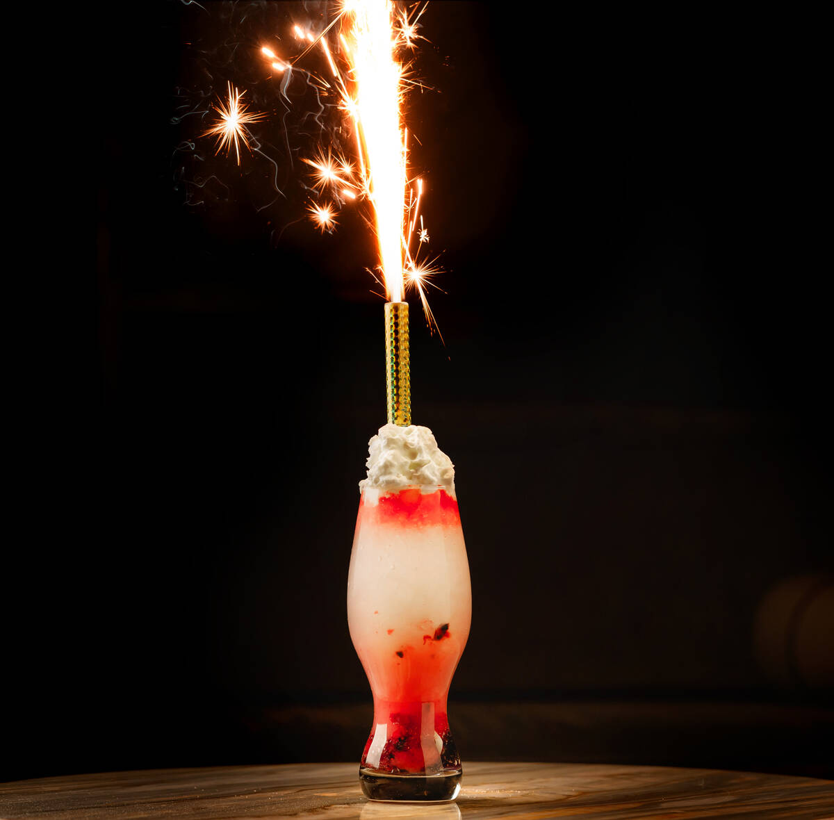 The Up All Night cocktail set with a fizzing sparkler appears on the tableside mixology menu at ...