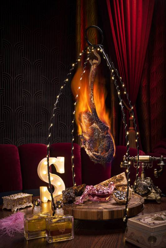 A 64-ounce super tomahawk steak is set alight with Cognac at Stanton Social Prime in Caesars Pa ...