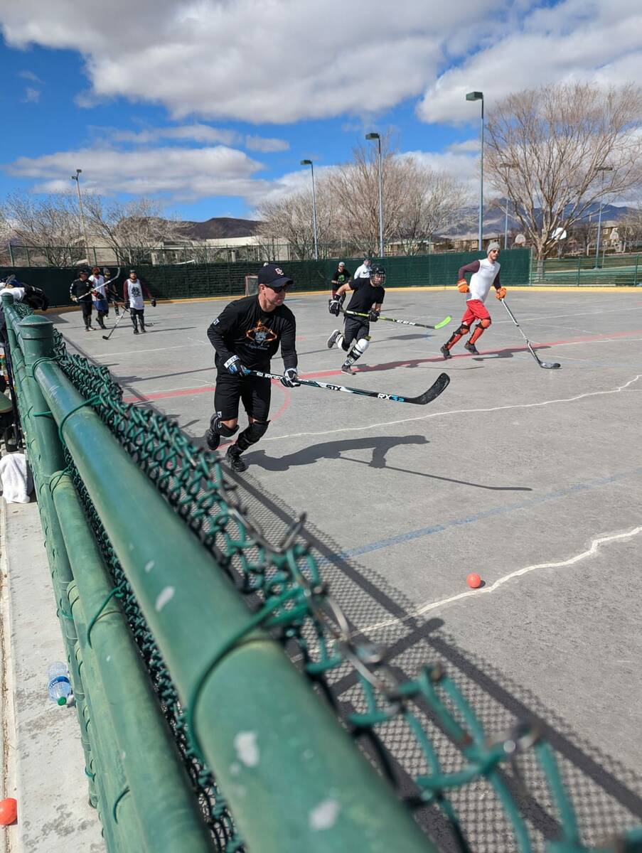 Ball hockey players on the court at Gardens Park in Summerlin. (Zack Hill)