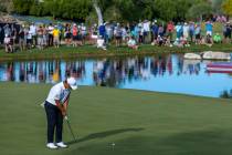 Tom Kim looks tom sink a long putt for the win on the 18th green during the final day of play i ...