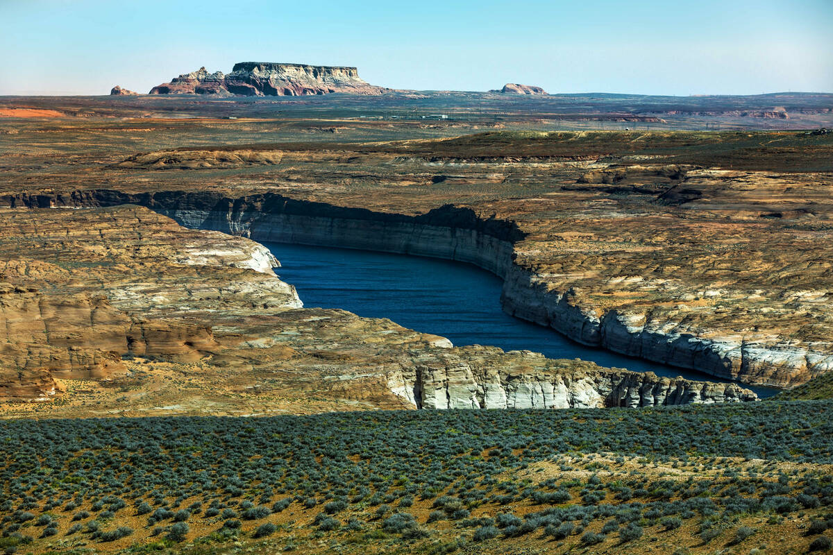 The Colorado River leaves Lake Powell onto the Glen Canyon Dam on April 18, 2023, in Page, Ariz ...